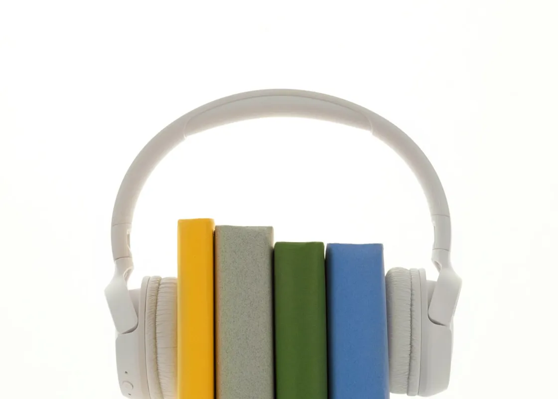 Headphones and a row of books
